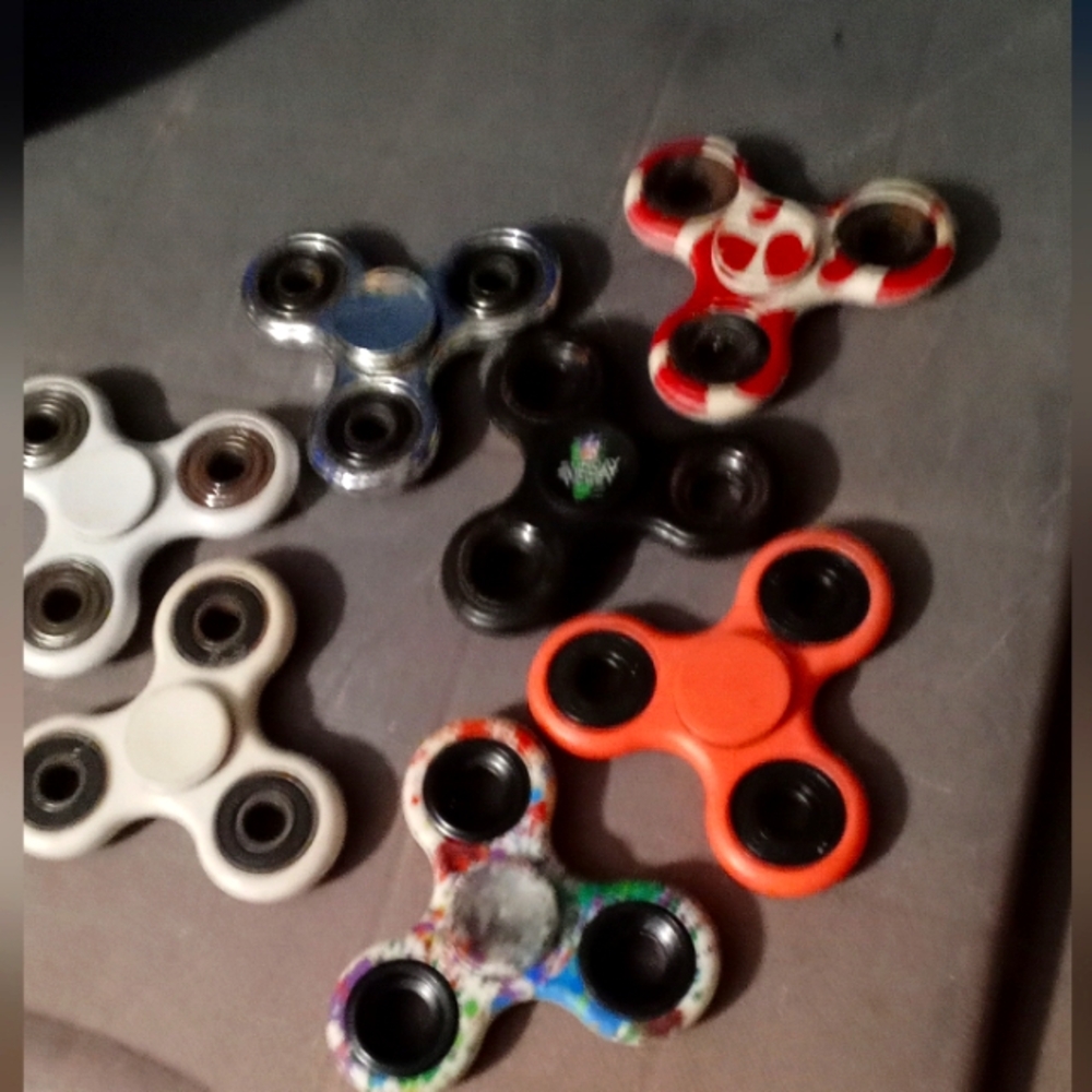 Fidget spinners, several colors, used but still in good shape